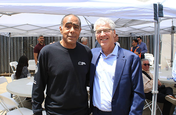 Weingart Center CEO Senator Kevin Murray (Ret.) with Los Angeles affordable housing architect Cory Creath from AXIS Architecture + Design, at the Weingart Tower topping out ceremony
